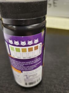 Bottle containing glucose test strip for pets