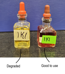 Two bottles of IKI. One is a clear yellow colour where the IKI has degraded and can no longer be used as an indicator. The other bottle is a dark amber colour where the IKI is still useable as an indicator.